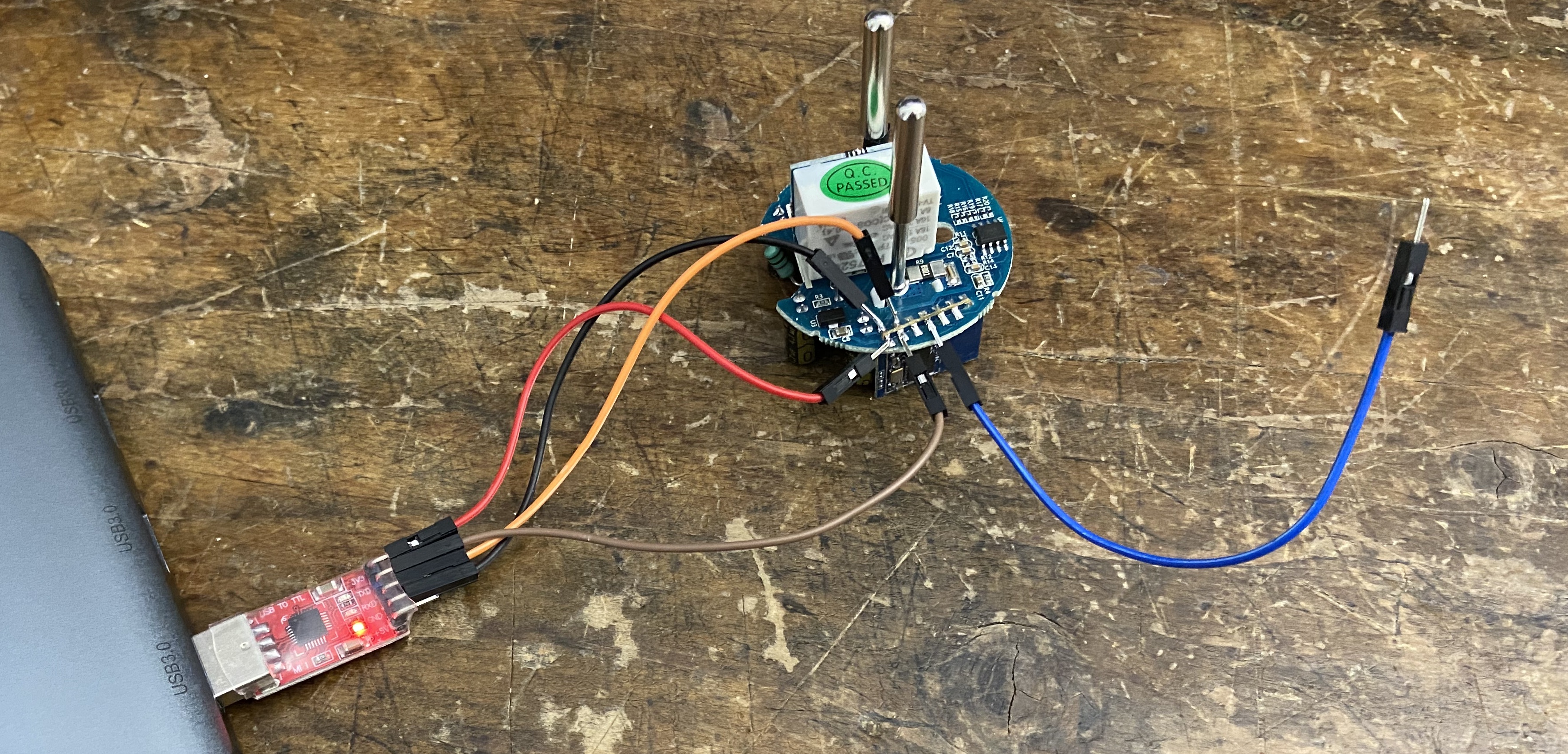 USB-to-TTL adapter soldered to the smart plug